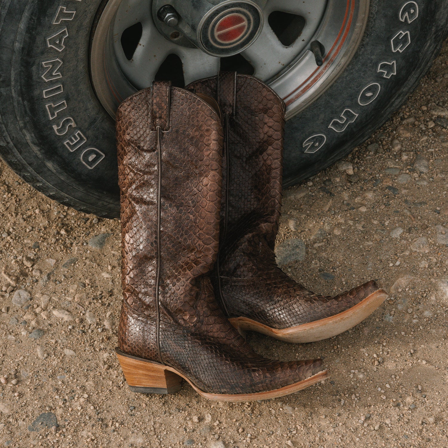 Boots by a tire