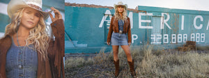 Woman in cowboy hat and denim outfit standing in front of a blue wall with 'AMERICA' written on it.